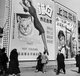 China: Pedestrians walk past an advertising billboard on a Shanghai Street, January 1, 1948